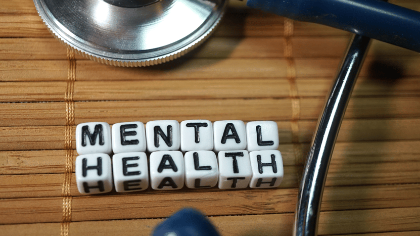 mental health spelled on blocks on a desk