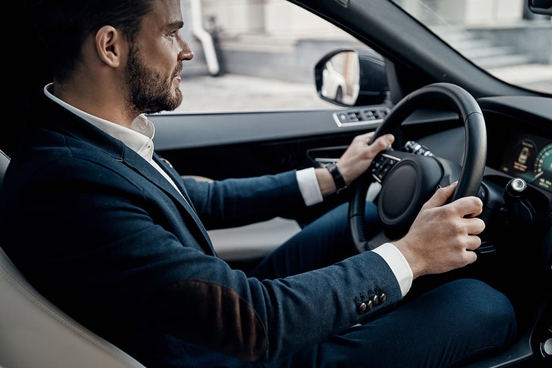 Businessman driving car