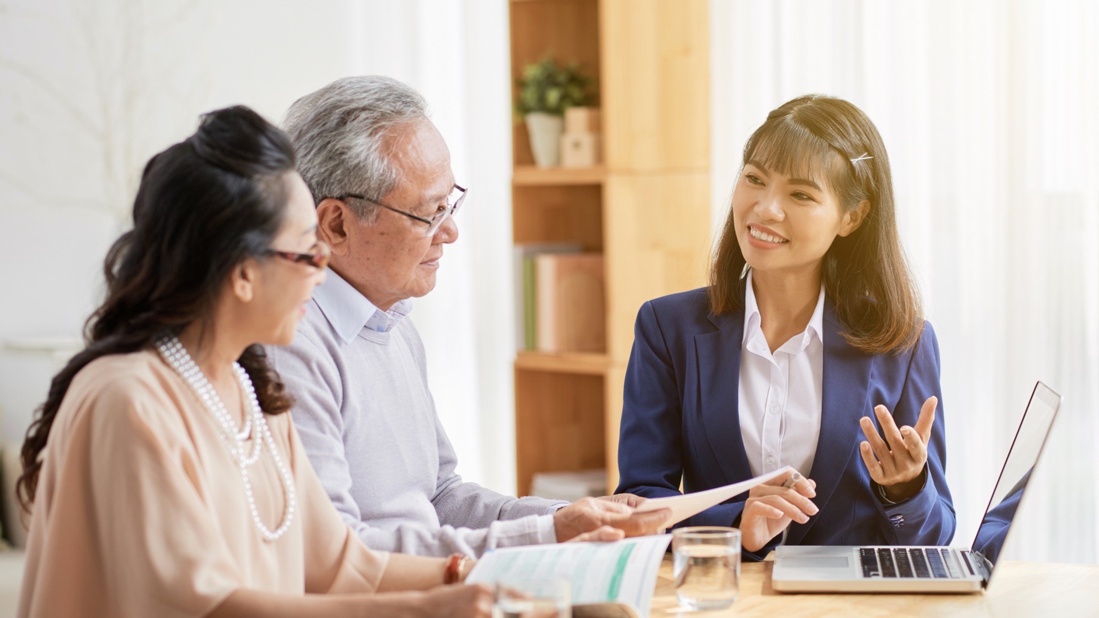 business woman presenting to two people