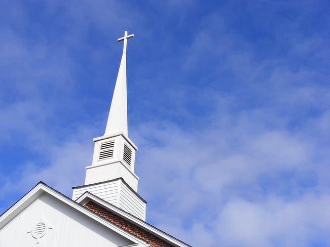 Church steeple against a blue sky