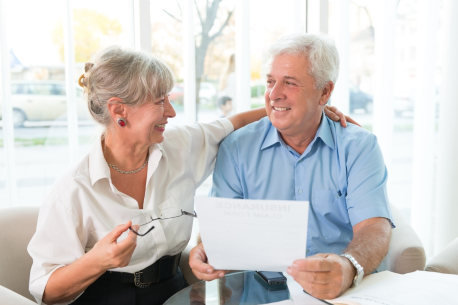 elderly couple with documents