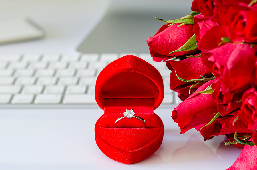 Gift box with ring and roses