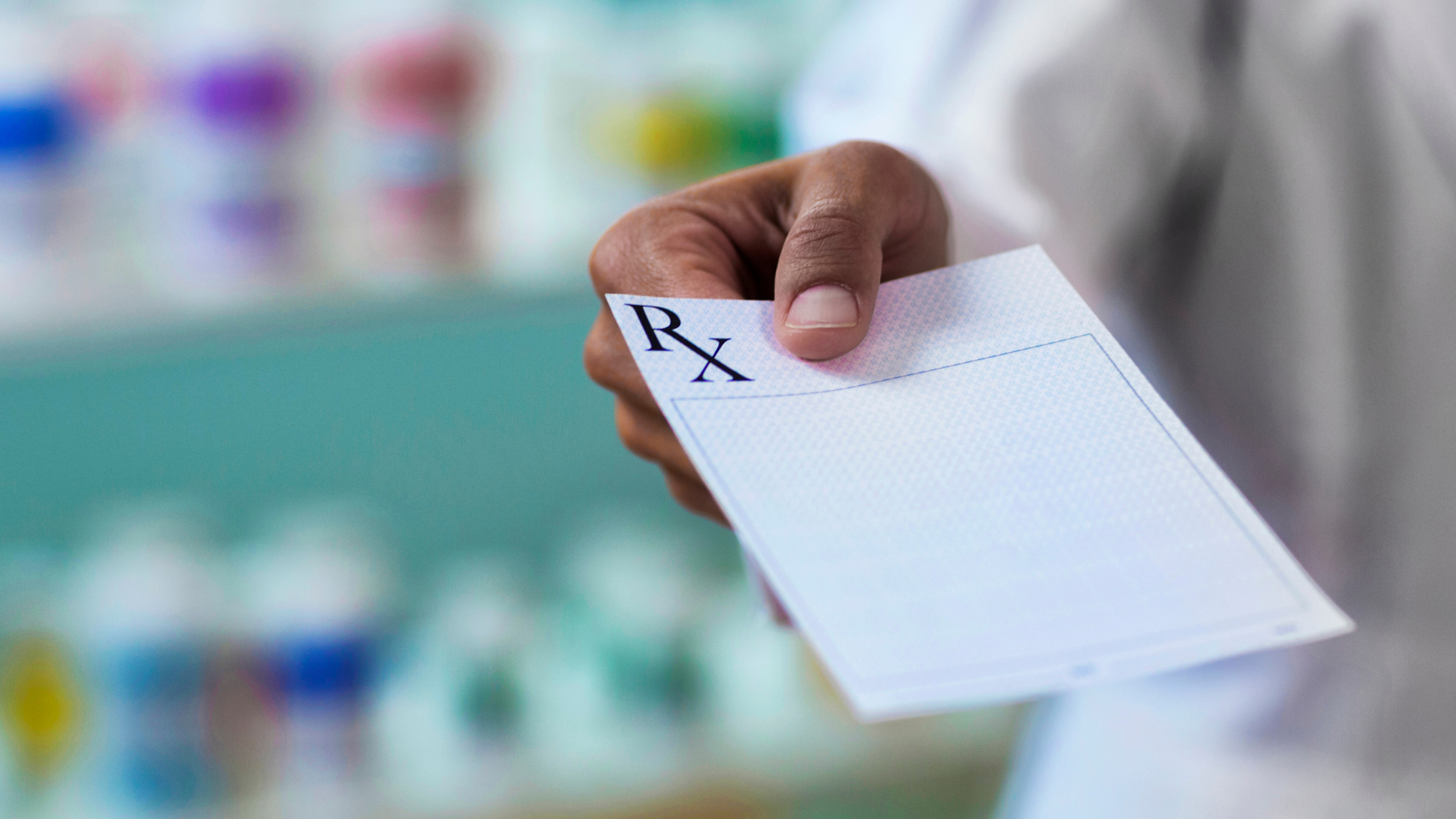 Doctor holding a prescription paper