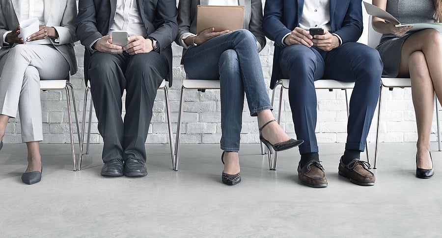 Job candidates wait for interview