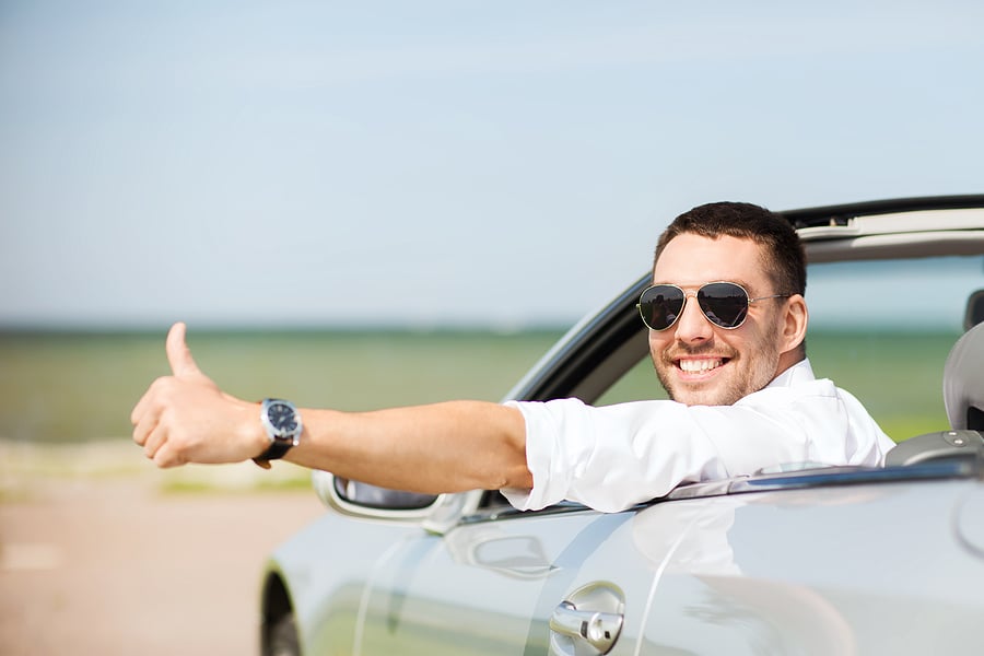 Man in convertible on vacation