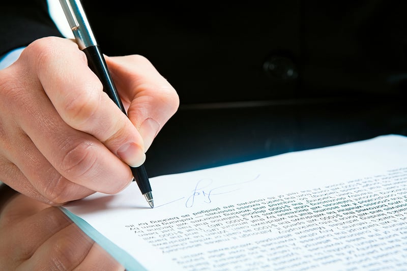 Person signing a contract