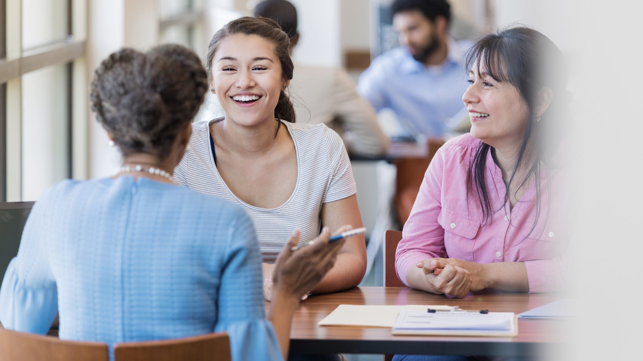 mother and daughter at a meeting with a woman