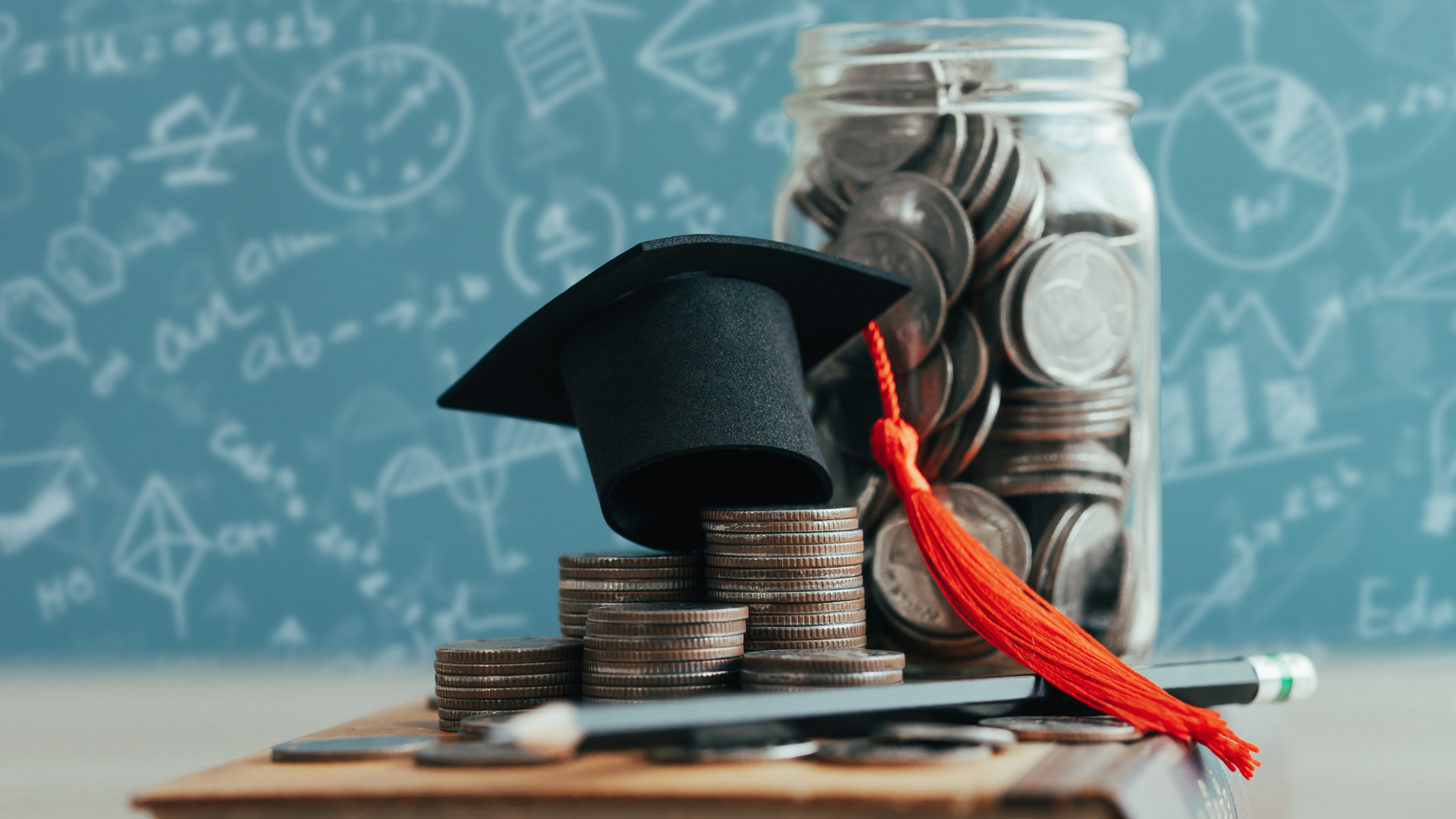 Small graduation cap on pile of coins