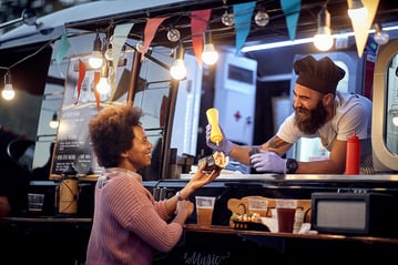 food truck employee helping a customer