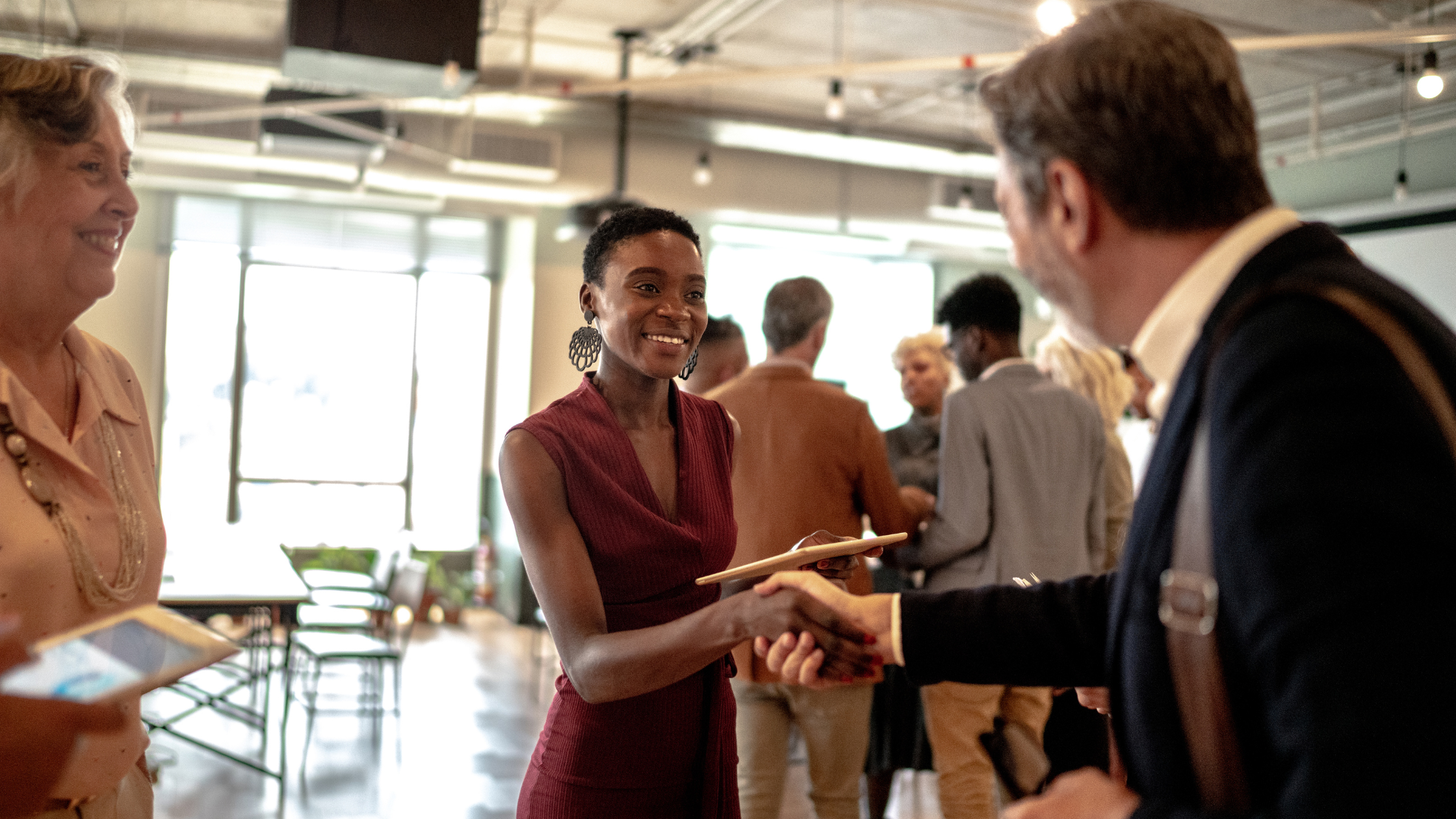 business people shaking hands at an event