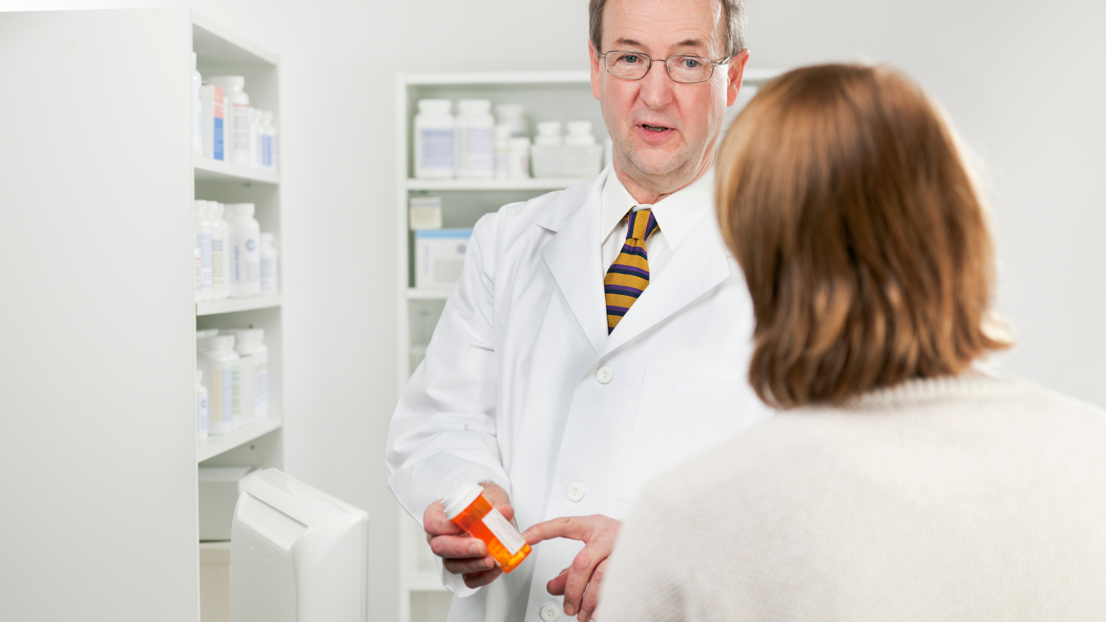 pharmacist giving a prescription 